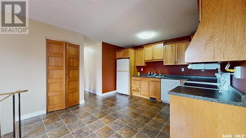 22 Cottonwood Bay, Regina, SK - Indoor Photo Showing Kitchen With Double Sink