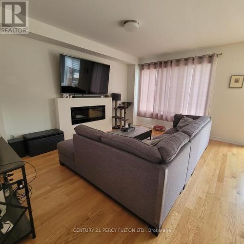 1965 Mcneil Street, Innisfil, ON - Indoor Photo Showing Living Room With Fireplace