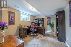 Basement bedroom, currently used as an office - 