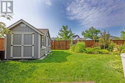 Grassy area and garden shed - 