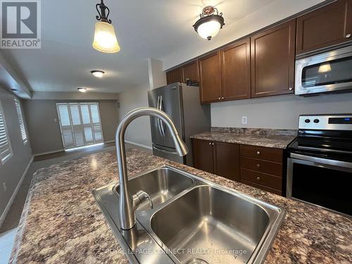 106 - 136 Aspen Springs Drive, Clarington (Bowmanville), ON - Indoor Photo Showing Kitchen With Double Sink