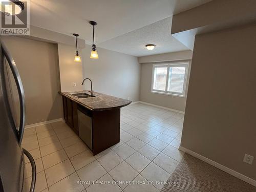 106 - 136 Aspen Springs Drive, Clarington (Bowmanville), ON - Indoor Photo Showing Kitchen With Double Sink