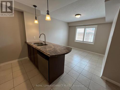 106 - 136 Aspen Springs Drive, Clarington (Bowmanville), ON - Indoor Photo Showing Kitchen With Double Sink