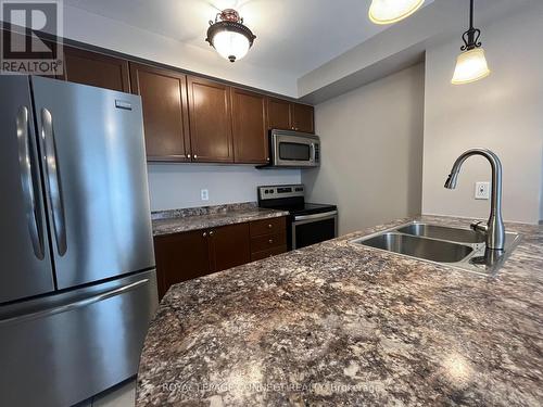 106 - 136 Aspen Springs Drive, Clarington (Bowmanville), ON - Indoor Photo Showing Kitchen With Double Sink