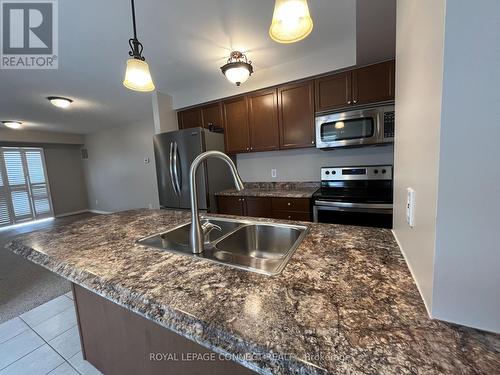 106 - 136 Aspen Springs Drive, Clarington (Bowmanville), ON - Indoor Photo Showing Kitchen With Double Sink With Upgraded Kitchen