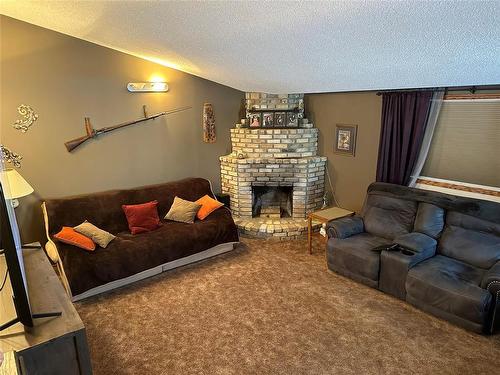 80045 36N Road, Glenboro, MB - Indoor Photo Showing Living Room With Fireplace