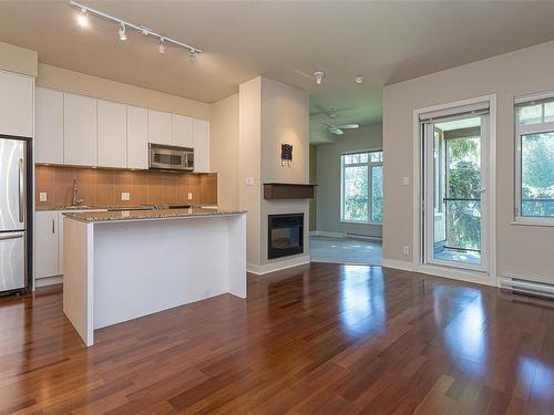 308-1375 Bear Mountain Pkwy, Langford, BC - Indoor Photo Showing Kitchen With Fireplace