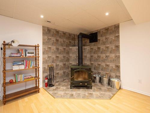 Playroom - 57 Rue Oakwood, Pincourt, QC - Indoor Photo Showing Other Room With Fireplace