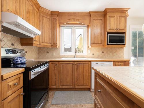 Kitchen - 57 Rue Oakwood, Pincourt, QC - Indoor Photo Showing Kitchen With Double Sink