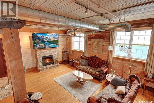 204 1170 Broad Street, Regina, SK - Indoor Photo Showing Living Room With Fireplace