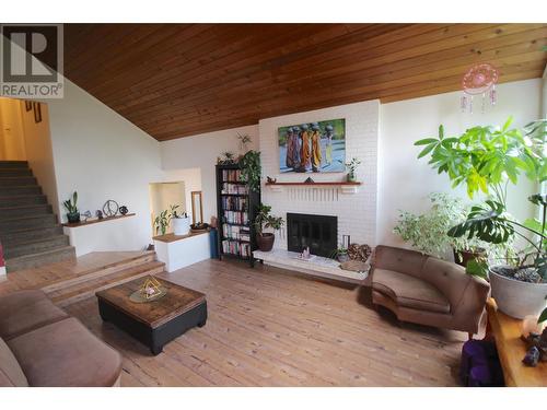 1726 Cedarwood Court, Dawson Creek, BC - Indoor Photo Showing Living Room With Fireplace