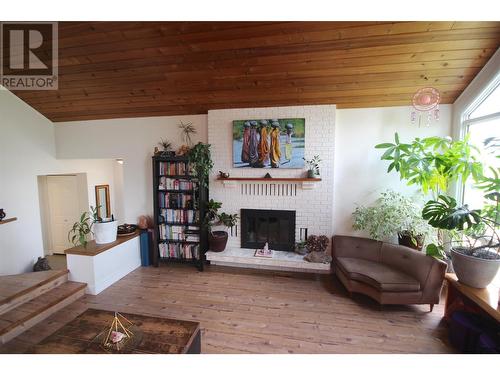 1726 Cedarwood Court, Dawson Creek, BC - Indoor Photo Showing Living Room With Fireplace