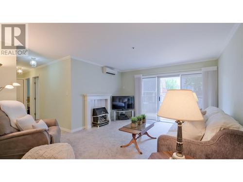 920 Argyle Street Unit# 103, Penticton, BC - Indoor Photo Showing Living Room With Fireplace