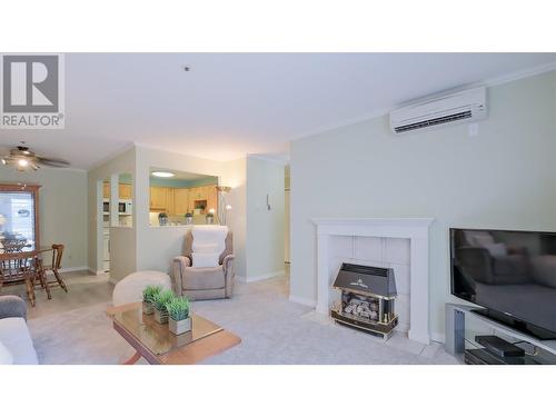 920 Argyle Street Unit# 103, Penticton, BC - Indoor Photo Showing Living Room With Fireplace