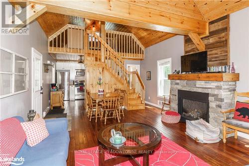 684A South Shore Road, South River, ON - Indoor Photo Showing Living Room With Fireplace