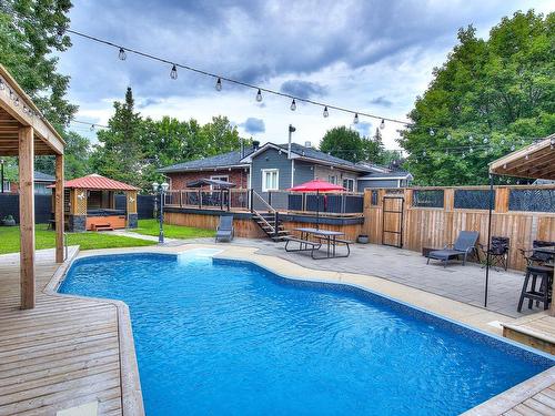 Piscine - 50 Boul. Ste-Rose, Laval (Sainte-Rose), QC - Outdoor With In Ground Pool With Deck Patio Veranda With Backyard With Exterior