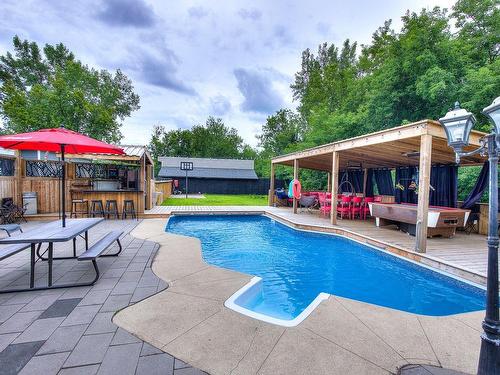 Piscine - 50 Boul. Ste-Rose, Laval (Sainte-Rose), QC - Outdoor With In Ground Pool With Deck Patio Veranda With Backyard