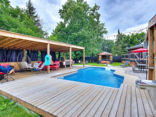 Vue d'ensemble - 50 Boul. Ste-Rose, Laval (Sainte-Rose), QC - Outdoor With In Ground Pool With Deck Patio Veranda With Backyard