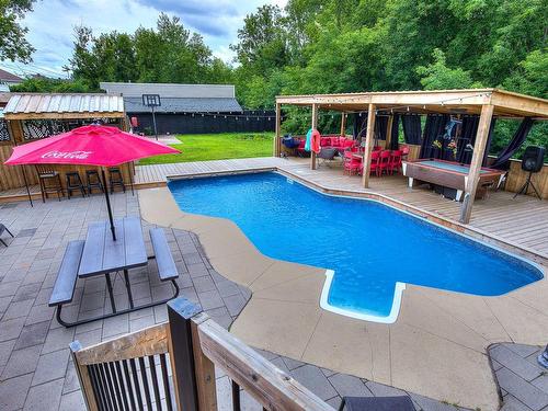 Vue d'ensemble - 50 Boul. Ste-Rose, Laval (Sainte-Rose), QC - Outdoor With In Ground Pool With Deck Patio Veranda With Backyard