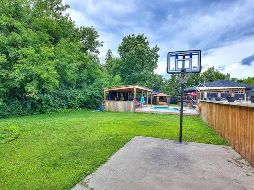 Hot tub - 50 Boul. Ste-Rose, Laval (Sainte-Rose), QC - Outdoor With Backyard