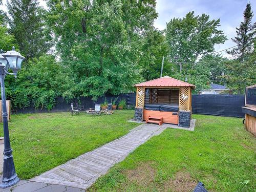 Hot tub - 50Z Boul. Ste-Rose, Laval (Sainte-Rose), QC - Outdoor With Backyard