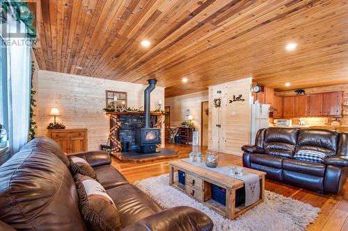 1519 6 Highway, Cherryville, BC - Indoor Photo Showing Living Room With Fireplace