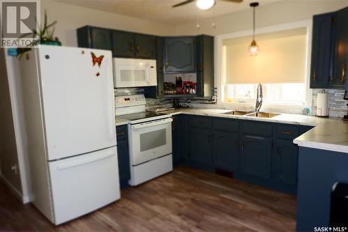 704 Leeville Drive, Assiniboia, SK - Indoor Photo Showing Kitchen With Double Sink