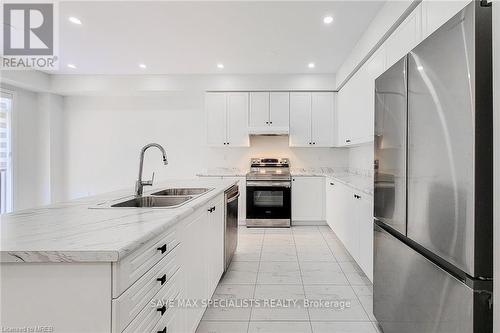 28 Hawick Crescent, Haldimand, ON - Indoor Photo Showing Kitchen With Stainless Steel Kitchen With Double Sink With Upgraded Kitchen