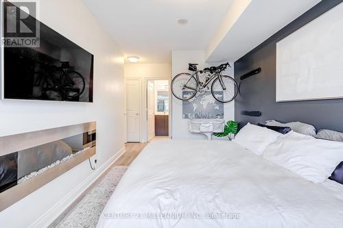 2407 - 16 Brookers Lane, Toronto, ON - Indoor Photo Showing Bedroom With Fireplace