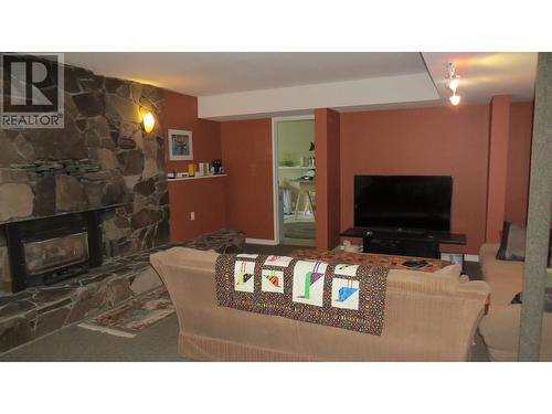 229 S Grosz Road, Quesnel, BC - Indoor Photo Showing Living Room With Fireplace