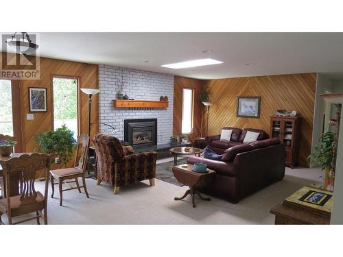 229 S Grosz Road, Quesnel, BC - Indoor Photo Showing Living Room With Fireplace