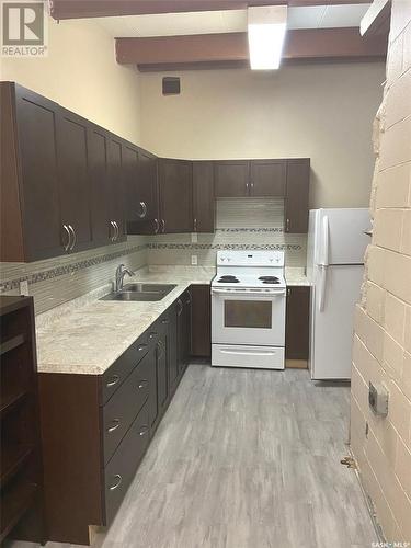 597 Broadway Street W, Fort Qu'Appelle, SK - Indoor Photo Showing Kitchen With Double Sink