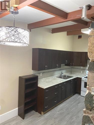 597 Broadway Street W, Fort Qu'Appelle, SK - Indoor Photo Showing Kitchen With Double Sink