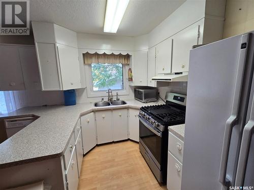 203 Calder Street, Kennedy, SK - Indoor Photo Showing Kitchen With Double Sink