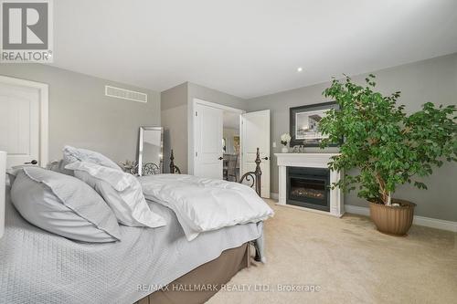 9 Fieldcrest Court, Brighton, ON - Indoor Photo Showing Bedroom With Fireplace