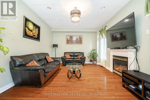 5669 Freshwater Drive, Mississauga (Churchill Meadows), ON - Indoor Photo Showing Living Room With Fireplace