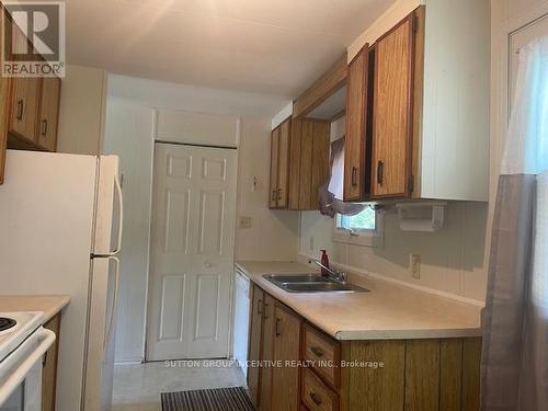 83 Hawthorne Drive, Innisfil, ON - Indoor Photo Showing Kitchen With Double Sink