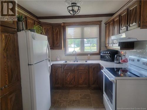 222 Marie, Beresford, NB - Indoor Photo Showing Kitchen With Double Sink