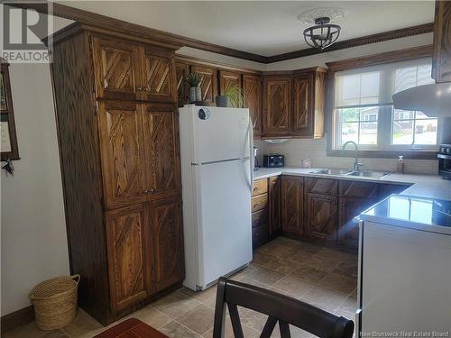 222 Marie, Beresford, NB - Indoor Photo Showing Kitchen With Double Sink