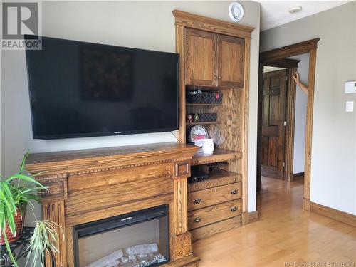 222 Marie, Beresford, NB - Indoor Photo Showing Living Room With Fireplace