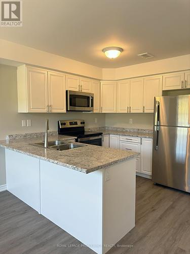 712 - 448 Drewery Road, Cobourg, ON - Indoor Photo Showing Kitchen With Stainless Steel Kitchen With Double Sink