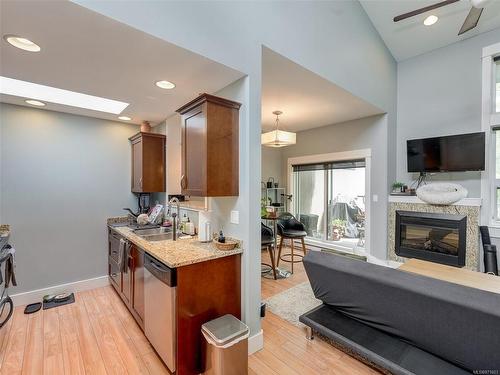 307-630 Speed Ave, Victoria, BC - Indoor Photo Showing Kitchen With Fireplace With Double Sink