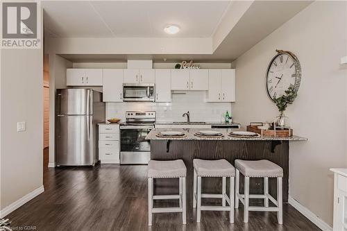 35 Kingsbury Square Square Unit# 313, Guelph, ON - Indoor Photo Showing Kitchen With Stainless Steel Kitchen With Upgraded Kitchen