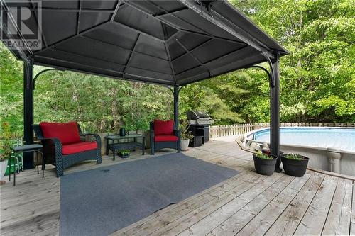 Covered seating outside dining room. Gazebo included. Pool included 'as is'. - 132 Manion Road, Carp, ON - Outdoor With Above Ground Pool With Deck Patio Veranda With Exterior