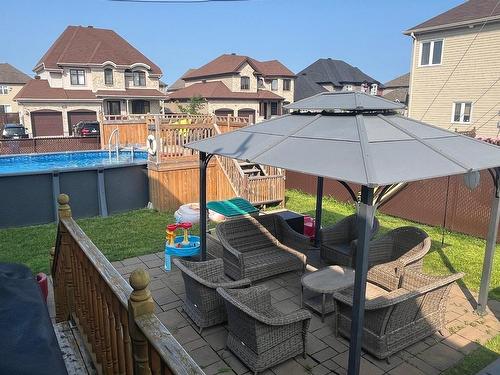 Backyard - 209 Rue Beethoven, Vaudreuil-Dorion, QC - Outdoor With Above Ground Pool