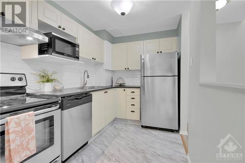 Kitchen area open to the dining room. - 119 Royalton Private, Ottawa, ON 