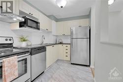 Kitchen area open to the dining room. - 