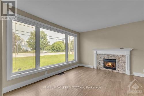 6036 Perth Street, Ottawa, ON - Indoor Photo Showing Living Room With Fireplace