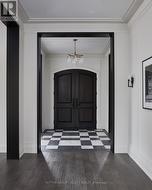 Custom cut porcelain floor & Mahogany entry doors - 