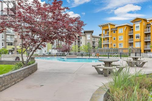 567 Yates Road Unit# 201, Kelowna, BC - Outdoor With In Ground Pool With Balcony With Facade